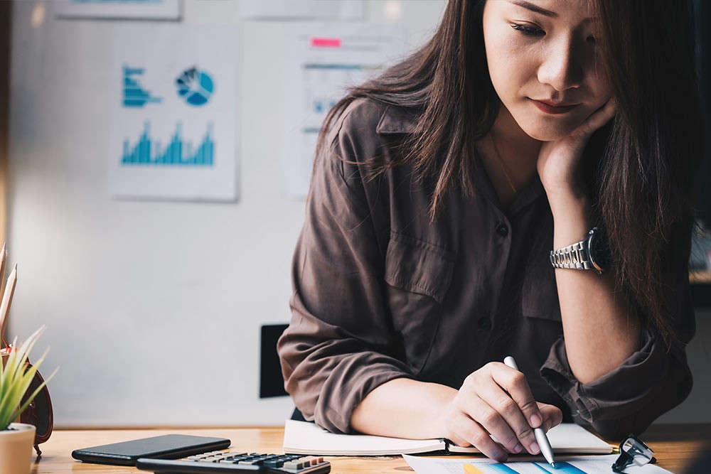 A person looking over some notes.