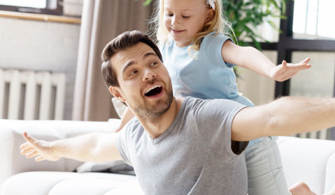 A father and daughter playing.
