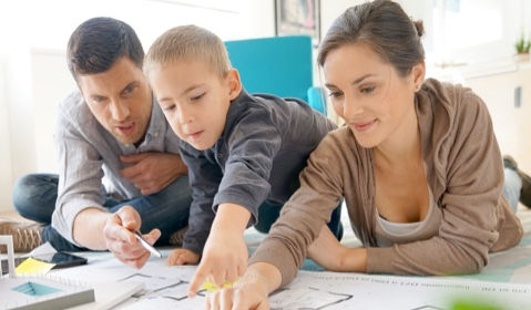 A family looking over designs.