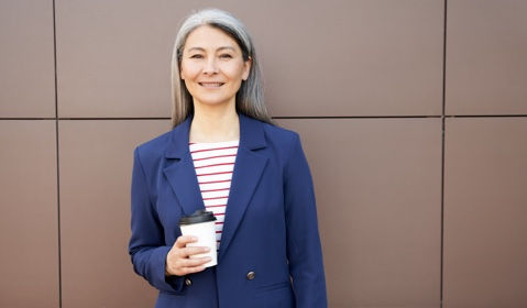 A person holding a coffee cup.